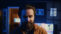 portrait-joyful-developer-writing-lines-code-notebook-close-up